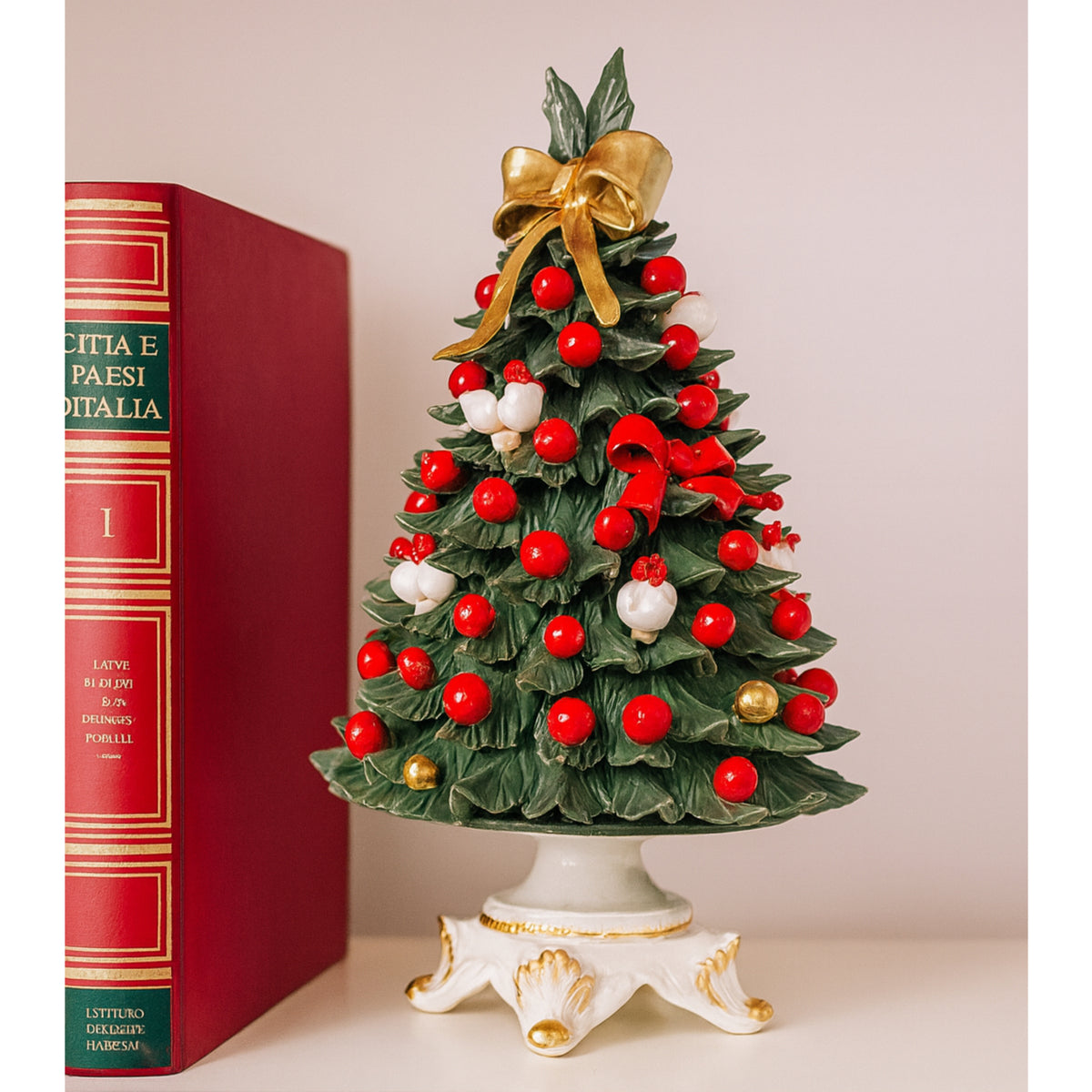 Porcelain Christmas tree with red and white decorations.